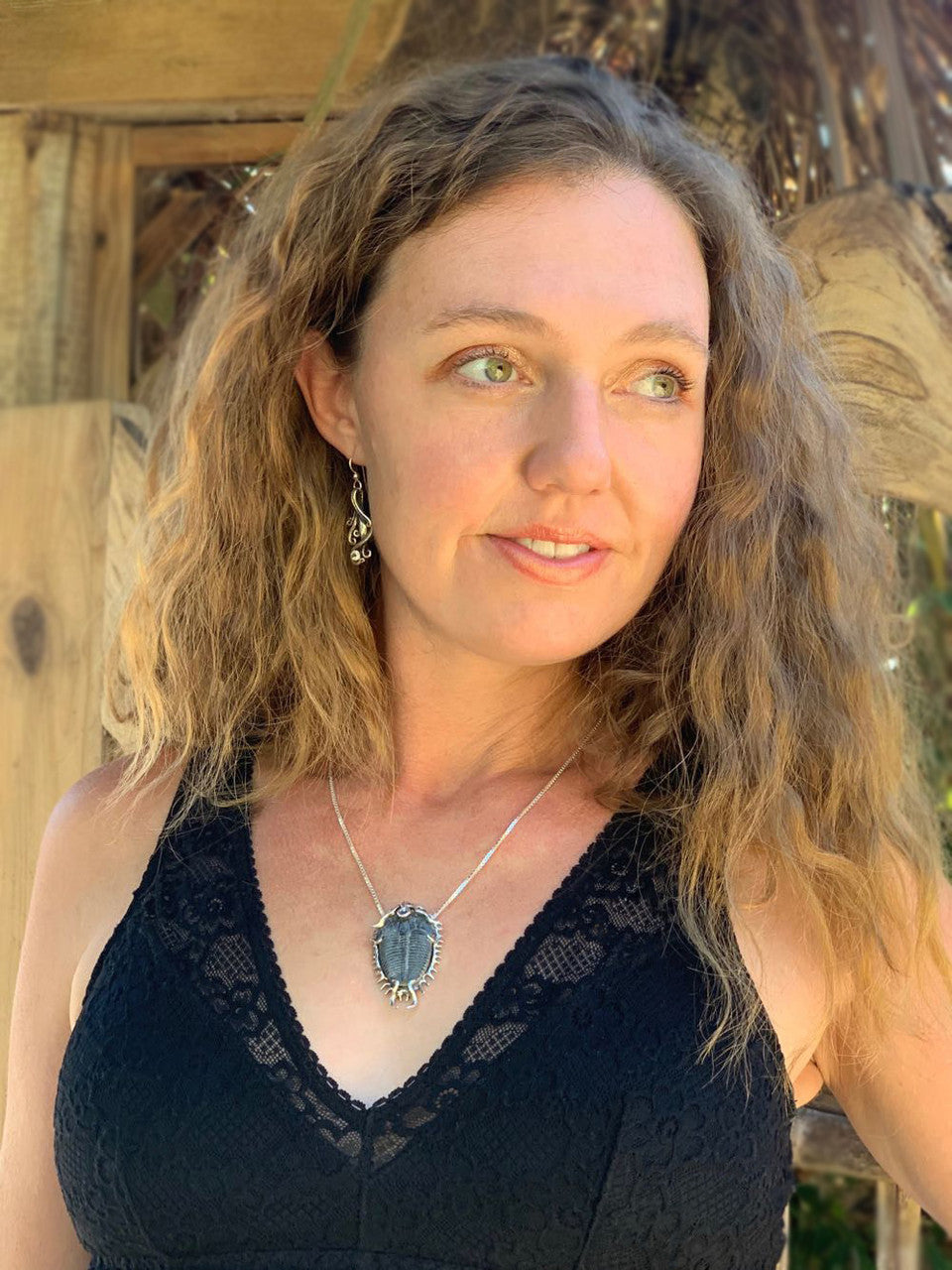 The Colossal Trilobite Pendant modeled by the artist,  Alisha McCormack
