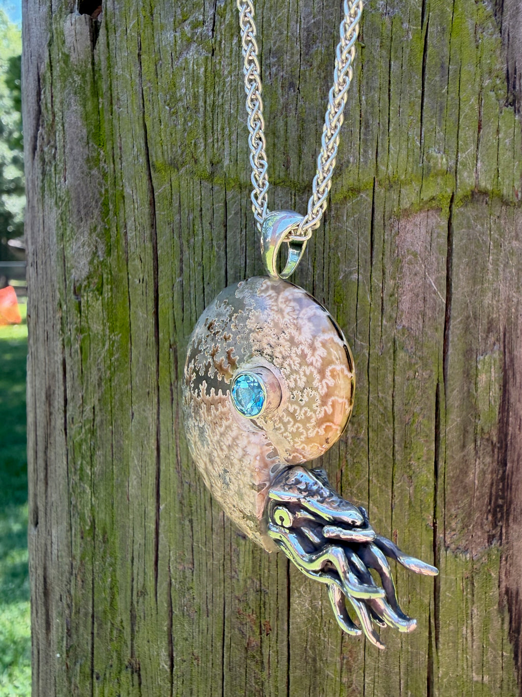 Fossilized Ammonite Nautilus Pendant with Blue Topaz - Sterling Silver