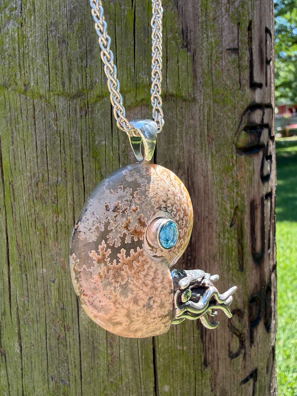 Fossilized Ammonite Nautilus Pendant with Blue Topaz - Sterling Silver