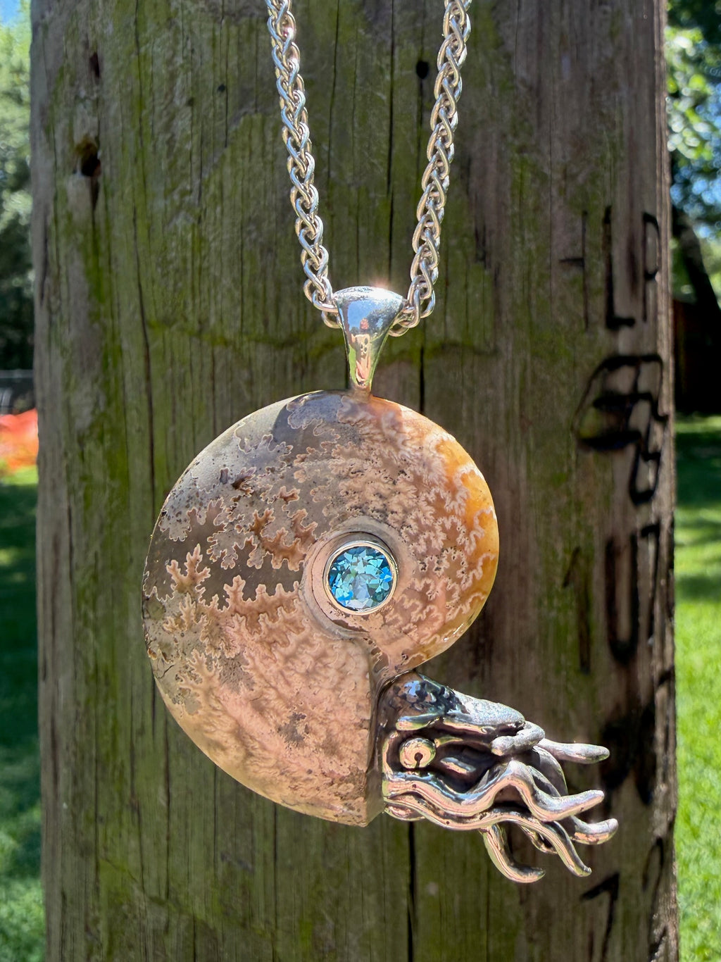 Fossilized Ammonite Nautilus Pendant with Blue Topaz - Sterling Silver