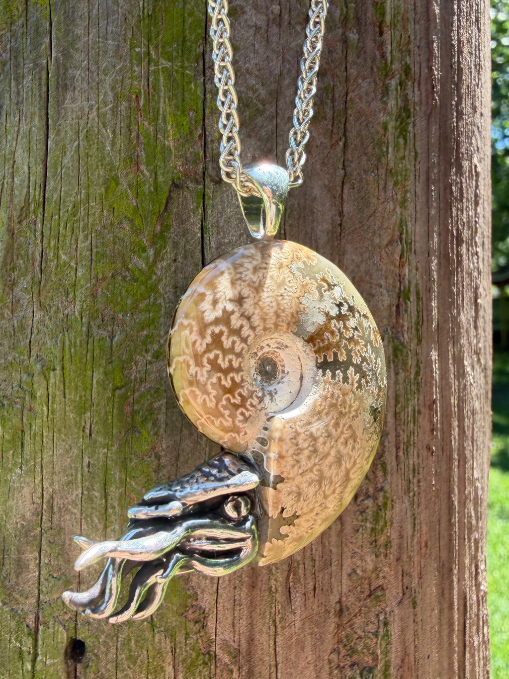 Fossilized Ammonite Nautilus Pendant with Blue Topaz - Sterling Silver