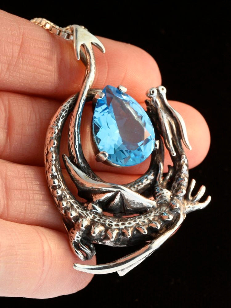 Curled Dragon Pendant with Blue Topaz
