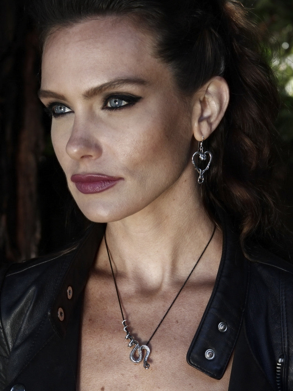 Danielle is wearing the Viper Valentine Earring Set and Python Snake Pendant in Sterling Silver