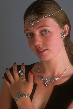 Model is wearing Sculpture Dragon Ring, Gothic Dragon Cuff, Gothic Dragon Neckpiece, and Sentry Dragon Ear Cuff. Ask us about the Gothic Dragon Headpiece!