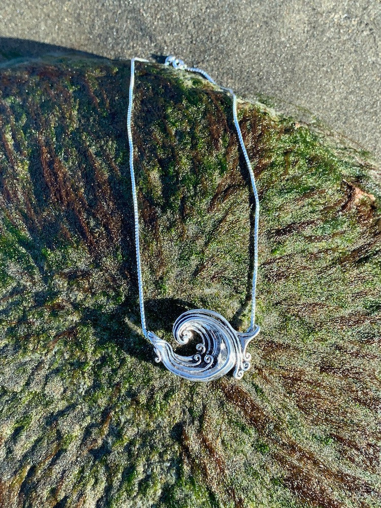 Sterling Silver Rip Curl Pendant at Beach