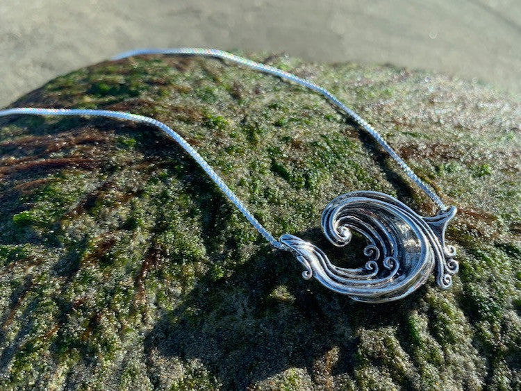 Sterling Silver Rip Curl Pendant at Beach