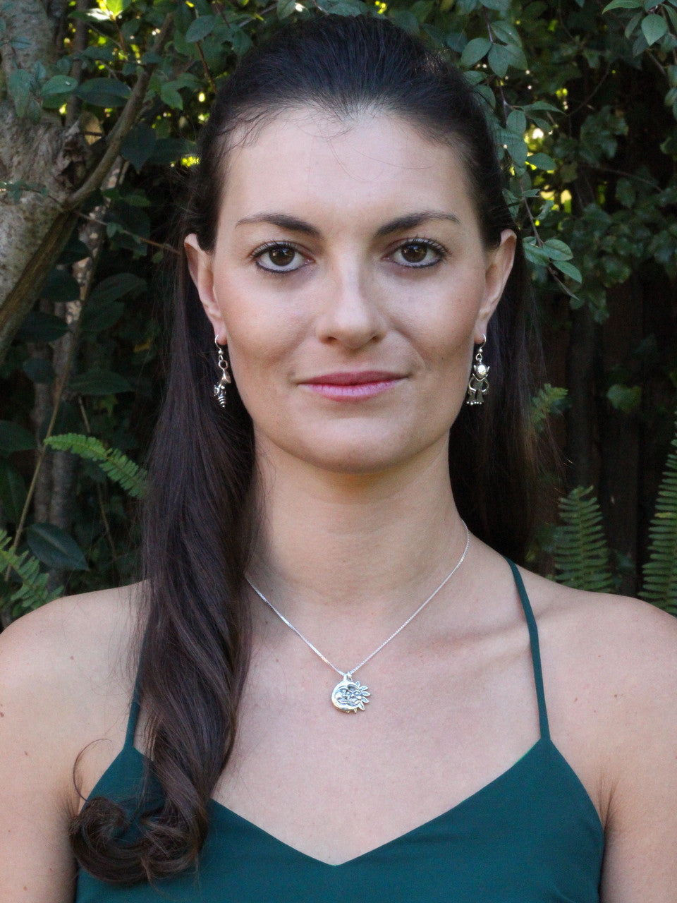 Jessica is wearing Alien Martian and Ray Gun Earrings and the Eclipse Pendant