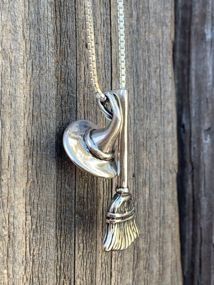 Stir up some magic when you wear the Witch's Hat and Witch's Broom Charm necklace