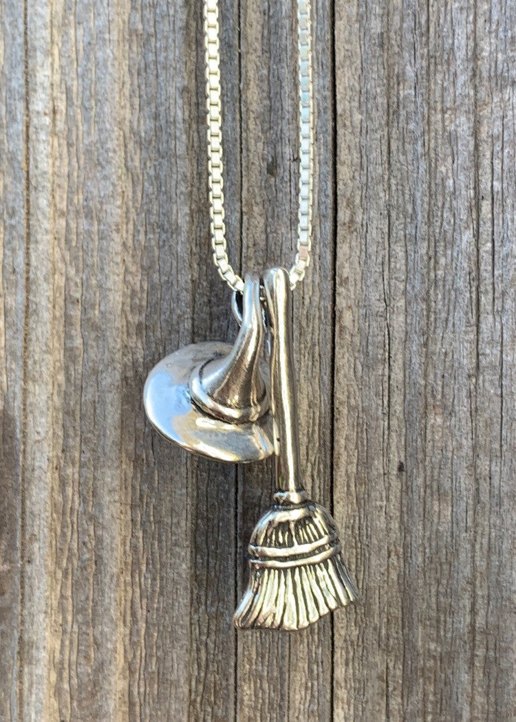 Stir up some magic when you wear the Witch's Hat and Witch's Broom Charm necklace