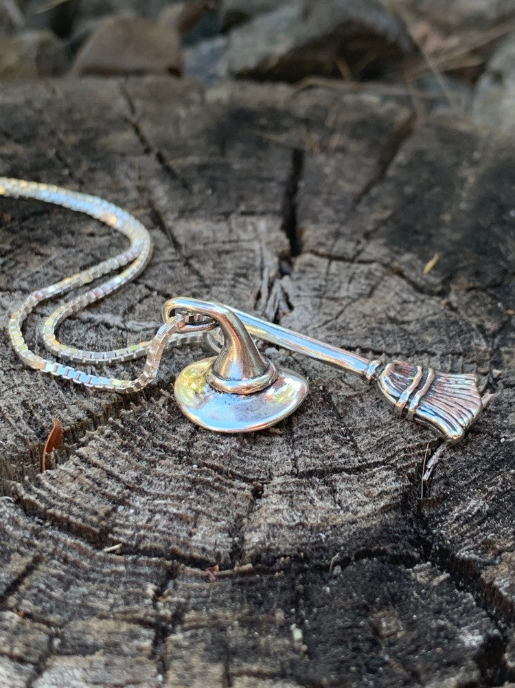 Stir up some magic when you wear the Witch's Hat and Witch's Broom Charm necklace