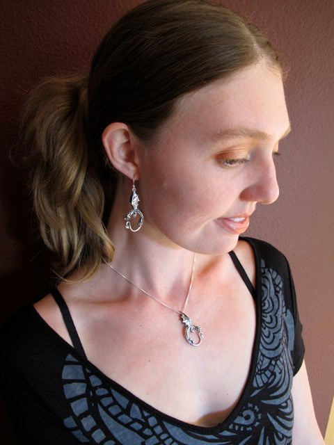 Alisha modeling the Oracle Dragon Earring collection - Silver