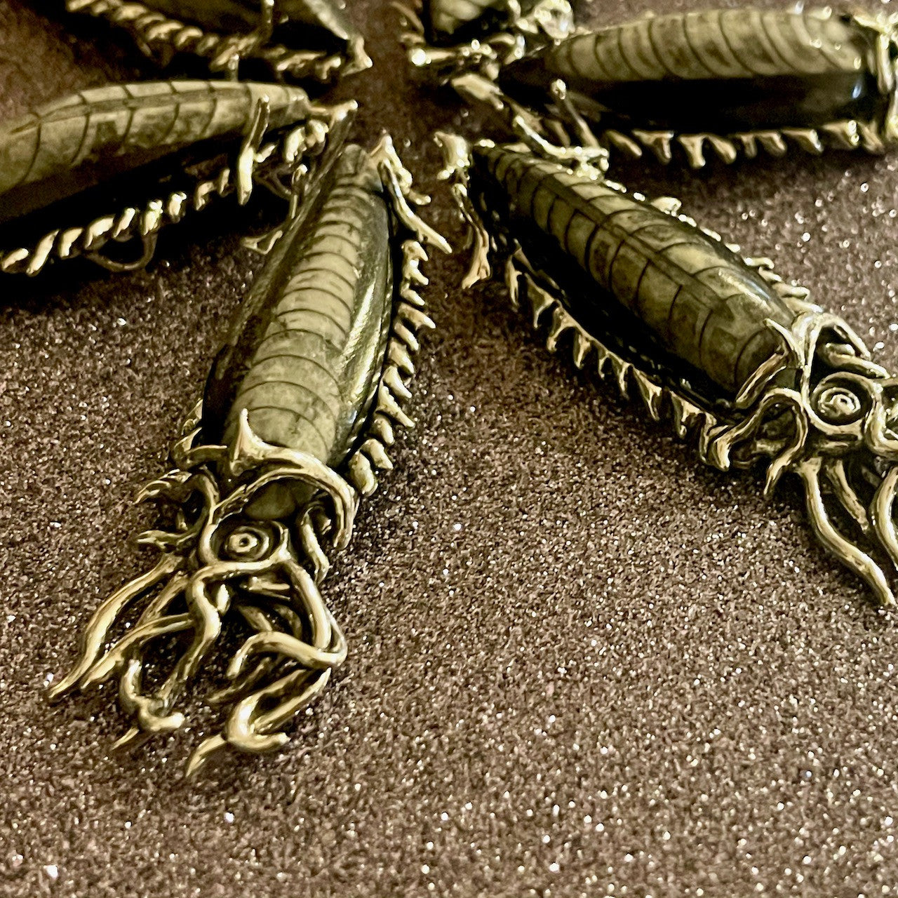 School of Fossilized Orthoceras Creature Pendant