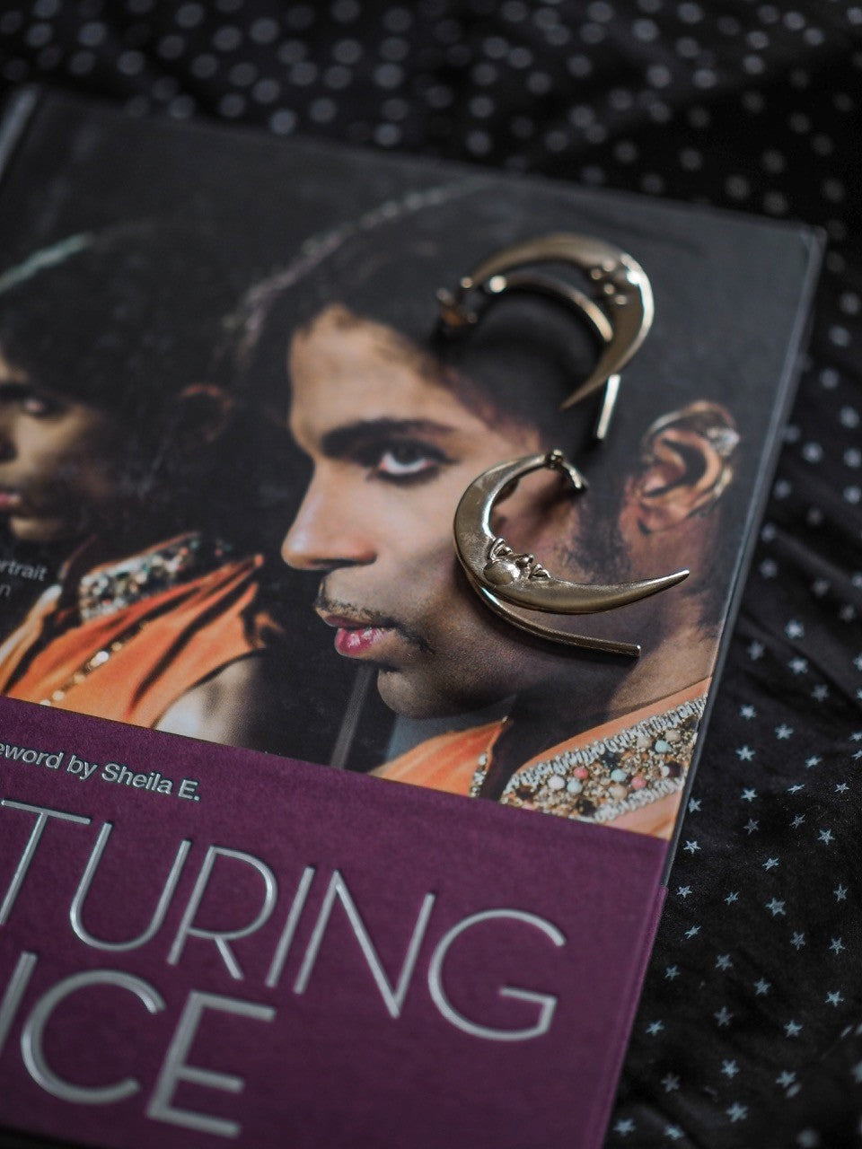 Prince wearing Crescent Moon Ear Wrap
