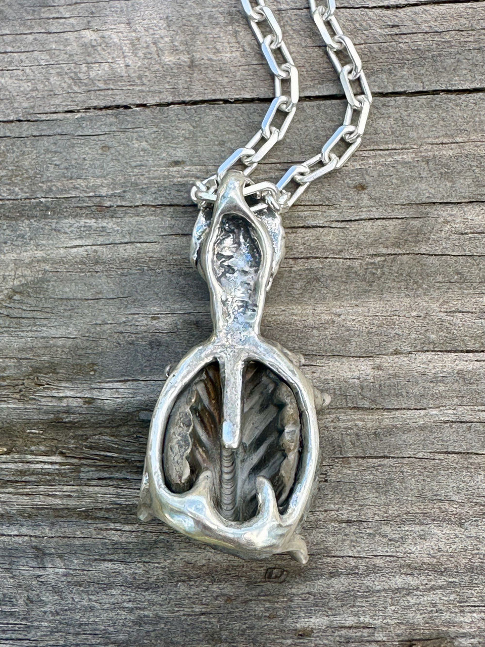 Raven Skull with Ammonite Negative and Tsavorite Eyes - Silver