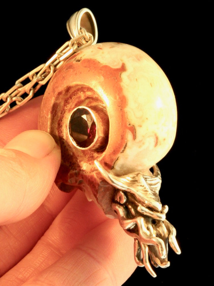 Colossal Carved Skull Ammonite Nautilus Pendant with 10mm Garnet