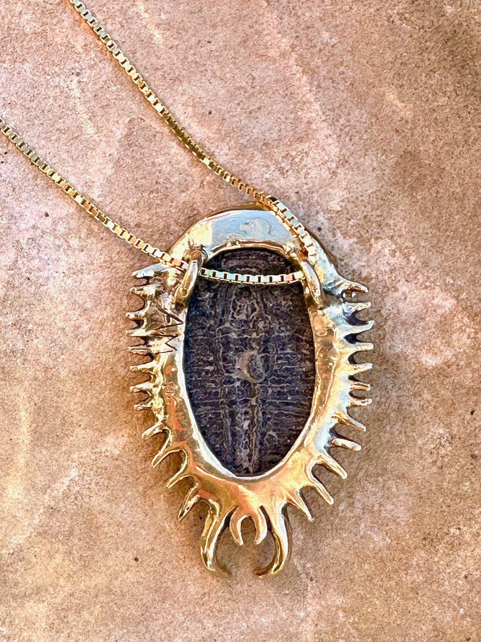 Back view of Colossal Spiked Trilobite with Fire Opal - 14k Gold