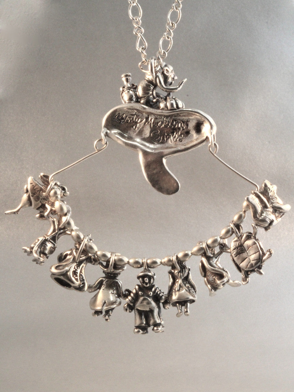 Reverse side of Alice in Wonderland Charm Collection - Silver