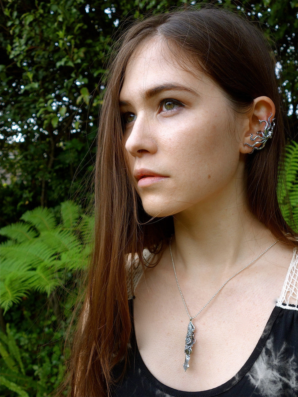 Teresa is pictured wearing the sterling silver Octopus ear cuff and Nautilus pendant