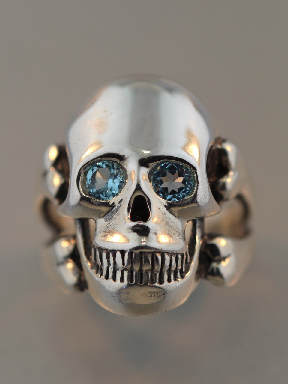 Large Skull and Crossbones Ring with Blue Topaz Eyes - Silver